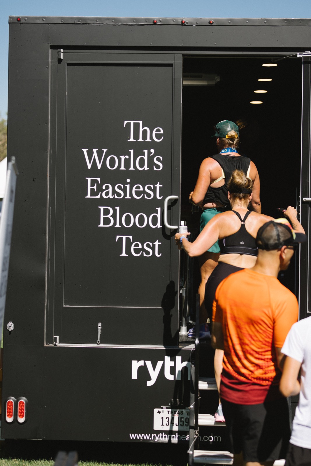 Visitors entering the Rythm blood testing truck